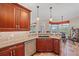 Kitchen breakfast nook featuring granite counters, wood cabinets, and a stainless steel dishwasher at 2023 Micanopy Trl, Nokomis, FL 34275