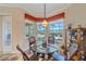 Breakfast nook with glass table and views of the pool at 2023 Micanopy Trl, Nokomis, FL 34275