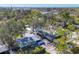 Aerial view showcasing a single-Gathering home with a spacious yard and lush landscaping at 2040 Palm Ter, Sarasota, FL 34231