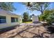 Landscaped backyard with shed and mature trees at 2040 Palm Ter, Sarasota, FL 34231