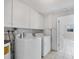 Bright laundry room features washer, dryer, and ample storage at 2040 Palm Ter, Sarasota, FL 34231