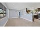 Open living area with kitchen and light purple walls and flooring at 2040 Palm Ter, Sarasota, FL 34231