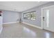 Spacious living room with light gray walls and terrazzo flooring at 2040 Palm Ter, Sarasota, FL 34231