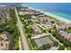 A birds-eye view of the resort, showcasing its proximity to the ocean and multiple amenities at 2089 Gulf Of Mexico Dr # G1-205, Longboat Key, FL 34228