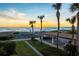 Condo with easy beach access, parking, and palm trees creating a tropical paradise at 2089 Gulf Of Mexico Dr # G1-205, Longboat Key, FL 34228