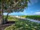 Enjoy this winding beach path with lush greenery and sandy steps to get to the beautiful ocean at 2089 Gulf Of Mexico Dr # G1-205, Longboat Key, FL 34228