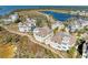 An aerial view of coastal homes near a lake and the ocean in a lushly landscaped community at 272 Saint Lucia Dr # 101, Bradenton, FL 34209