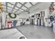 Spacious garage with epoxy floor and ample storage solutions to keep your belongings organized and secure at 272 Saint Lucia Dr # 101, Bradenton, FL 34209