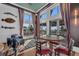 Restaurant seating area featuring floor to ceiling windows and a round table near an accent rug at 272 Saint Lucia Dr # 101, Bradenton, FL 34209