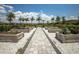 A vibrant community garden with organized plant beds at 3023 Vittorio Ct, Lakewood Ranch, FL 34211