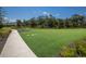 Expansive green lawn area with walking path, offering outdoor recreation and relaxation at 3023 Vittorio Ct, Lakewood Ranch, FL 34211