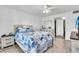 Comfortable bedroom with a ceiling fan, closet and coastal themed decor at 3050 Lake Bayshore Dr # O-108, Bradenton, FL 34205