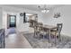 Dining room adjacent to the kitchen with table and chairs set on an accent rug at 3050 Lake Bayshore Dr # O-108, Bradenton, FL 34205