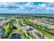 Aerial view of the community with lush landscaping and beautiful homes surrounding tranquil ponds at 3105 Formia Ct, Bradenton, FL 34211