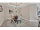 Cozy dining area with a chandelier and seating for four, perfect for intimate meals at 3105 Formia Ct, Bradenton, FL 34211