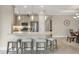 Modern kitchen with stainless steel appliances, breakfast bar, and pendant lighting at 3105 Formia Ct, Bradenton, FL 34211