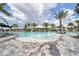 Resort-style community pool with a shallow entry, lounge seating and the Bahama Bar in the background at 3105 Formia Ct, Bradenton, FL 34211