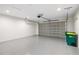 Clean garage with epoxy flooring and modern garage door at 336 Milford St, Port Charlotte, FL 33953