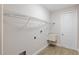 Laundry room with utility sink, storage shelf, and tiled floor at 336 Milford St, Port Charlotte, FL 33953