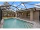 Enjoy the screened-in pool and patio, offering a private outdoor oasis for relaxation and recreation at 336 Milford St, Port Charlotte, FL 33953