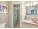 Charming bathroom features a glass shower, pink sink, and updated finishes at 3705 Tangier Ter, Sarasota, FL 34239