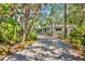 Exterior view of home with lush landscaping and a private driveway at 3705 Tangier Ter, Sarasota, FL 34239