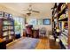 Bright home office featuring a wood desk, a ceiling fan with light, and natural light from a window at 3705 Tangier Ter, Sarasota, FL 34239