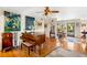 Stylish living room featuring hardwood floors, a piano, and elegant decor at 3705 Tangier Ter, Sarasota, FL 34239