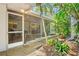 Relaxing screened porch with comfortable seating and serene garden views; perfect for outdoor relaxation at 3705 Tangier Ter, Sarasota, FL 34239