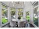 Breakfast nook featuring light-filled windows and views of lush backyard at 3759 Beneva Oaks Blvd, Sarasota, FL 34238