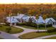 A beautiful single-story home with a metal roof, mature landscaping, and a circular driveway at 3759 Beneva Oaks Blvd, Sarasota, FL 34238