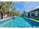 Inviting pool with a spa, lounge chairs, and a beautifully landscaped yard at 3759 Beneva Oaks Blvd, Sarasota, FL 34238