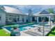 Resort-style backyard showcasing a pool, lounge area, and meticulously landscaped grounds at 3759 Beneva Oaks Blvd, Sarasota, FL 34238