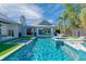 Stunning backyard pool area with a spa, lounge chairs, and ample space for entertainment at 3759 Beneva Oaks Blvd, Sarasota, FL 34238