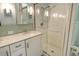 Bathroom with double vanity, large shower, and tile at 4147 Marseilles Ave # 3068, Sarasota, FL 34233