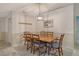 Bright dining room with wooden table and chairs, perfect for Gathering meals at 4147 Marseilles Ave # 3068, Sarasota, FL 34233