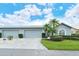 Gray house with attached garage and landscaping at 4147 Marseilles Ave # 3068, Sarasota, FL 34233