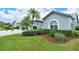 Gray house with palm trees and well-manicured lawn at 4147 Marseilles Ave # 3068, Sarasota, FL 34233