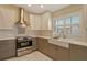 Modern kitchen with stainless steel appliances and white cabinets at 4147 Marseilles Ave # 3068, Sarasota, FL 34233