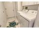 Laundry room with washer, dryer, and cabinets at 4147 Marseilles Ave # 3068, Sarasota, FL 34233