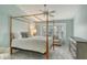 Serene main bedroom with a canopy bed, dresser, and a bay window at 4147 Marseilles Ave # 3068, Sarasota, FL 34233