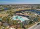 Aerial view of community pool, clubhouse, and surrounding homes at 431 Gris Sky Ln, Bradenton, FL 34212