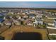 Aerial view of houses and pond at 431 Gris Sky Ln, Bradenton, FL 34212