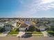 Aerial view of neighborhood and canal at 431 Gris Sky Ln, Bradenton, FL 34212