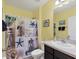 Bathroom with a shower/tub combo and beach-themed decor at 431 Gris Sky Ln, Bradenton, FL 34212