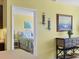 View of bedroom with white wicker headboard and light green bedding at 431 Gris Sky Ln, Bradenton, FL 34212