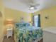 Bedroom with King bed, ceiling fan, and a view of the backyard at 431 Gris Sky Ln, Bradenton, FL 34212