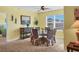 Bright dining room with wicker chairs and a glass-top table at 431 Gris Sky Ln, Bradenton, FL 34212