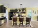 Modern kitchen with dark cabinetry and an island at 431 Gris Sky Ln, Bradenton, FL 34212