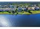 Aerial view of home highlighting the pool, pond view, and serene surroundings at 4617 Garden Arbor Way, Bradenton, FL 34203